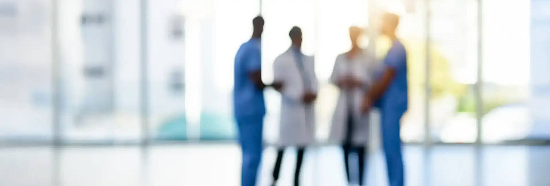 Silhouette of four healthcare professionals
